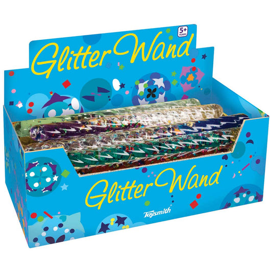 A display box containing a Mystical Spiral Glitter Wand with rainbow glitter specks and shapes, with the Toysmith logo visible.