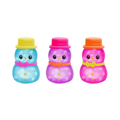 Three toy figures resembling snowmen with colorful accents; one is blue with a yellow hat, another is purple with a pink hat, and the third is pink with a blue hat.