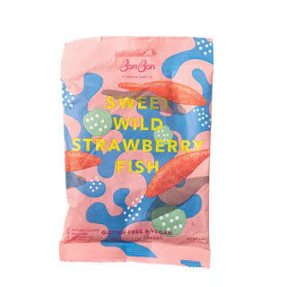 A pink package of BonBon Sweet Wild Strawberry Fish with a pattern of strawberries and seashells. The text on the package indicates that the product is gluten-free, vegan, and contains fish.
