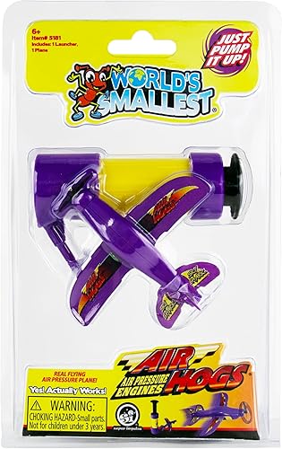 Packaged 'World's Smallest Air Hogs' toy in purple color with the product visible through a clear plastic window on a yellow and purple cardboard backing.