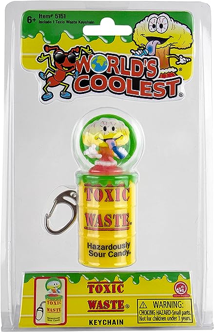 Packaged keychain toy with a character named 'Toxic Waste' designed to pop up from a drum when squeezed, marketed as the 'World's Coolest Toxic Waste'.