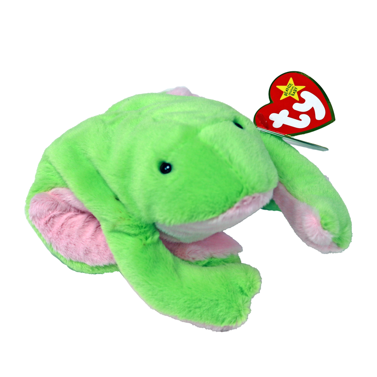 A plush green frog toy with long legs, designed for children. The toy is attached to a star-shaped label with the letter 'T' on it.
