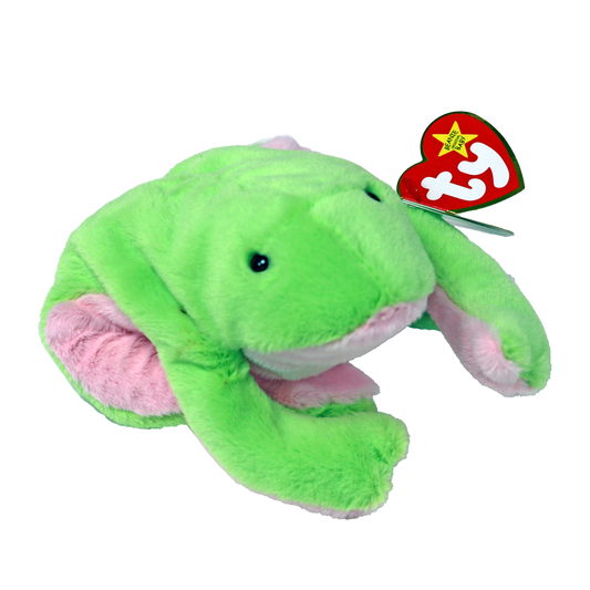 A plush green frog toy with long legs, designed for children. The toy is attached to a star-shaped label with the letter 'T' on it.