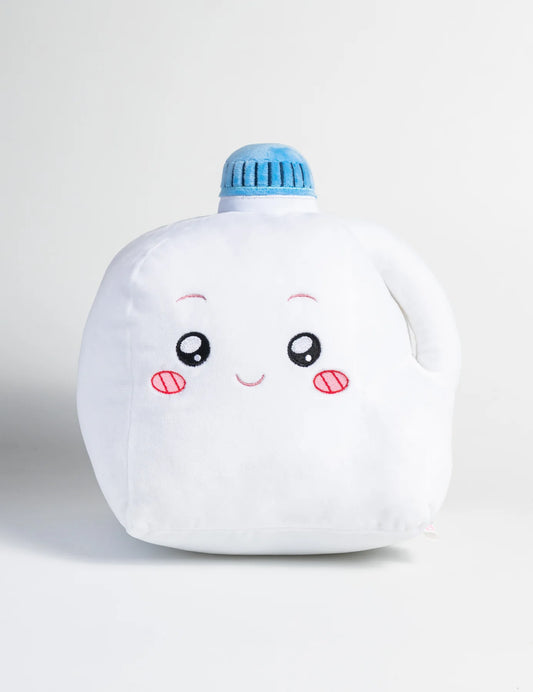 Plush toy shaped like a milk bottle with a face on a white background
