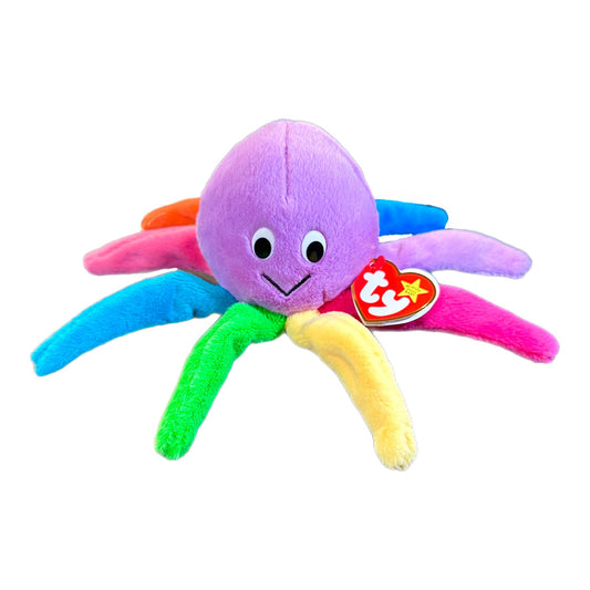 A multicolored plush toy resembling an octopus with a smiling face, featuring arm segments in different colors and a 'TY' logo on the head.