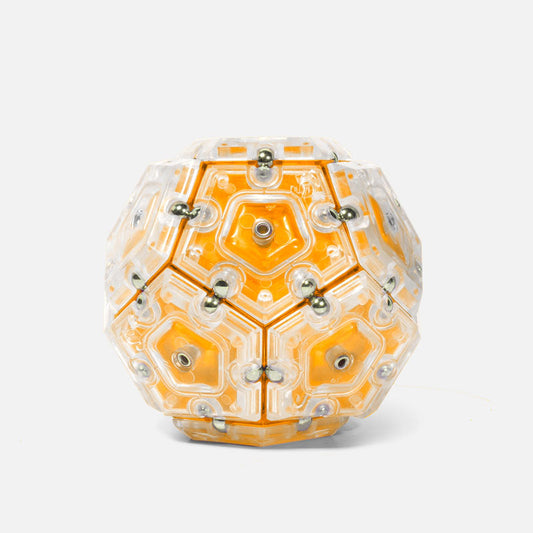 A geometric orange fidget toy made of pentagons that align and snap together.