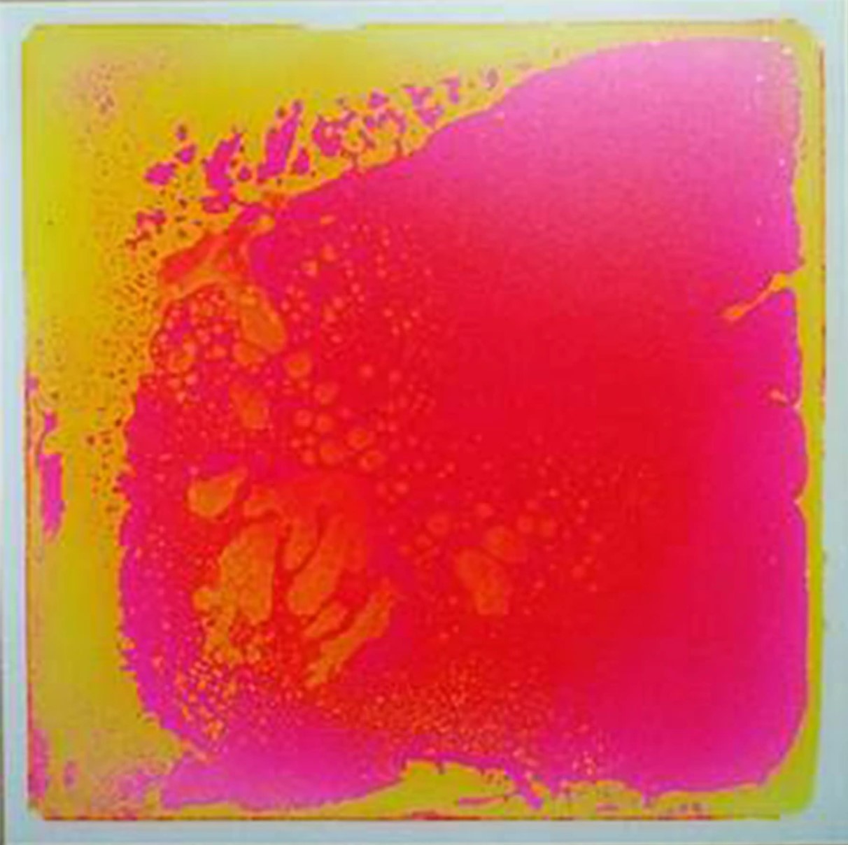 A close-up view of a Surfloor Liquid Tile with a pink and yellow splatter pattern.