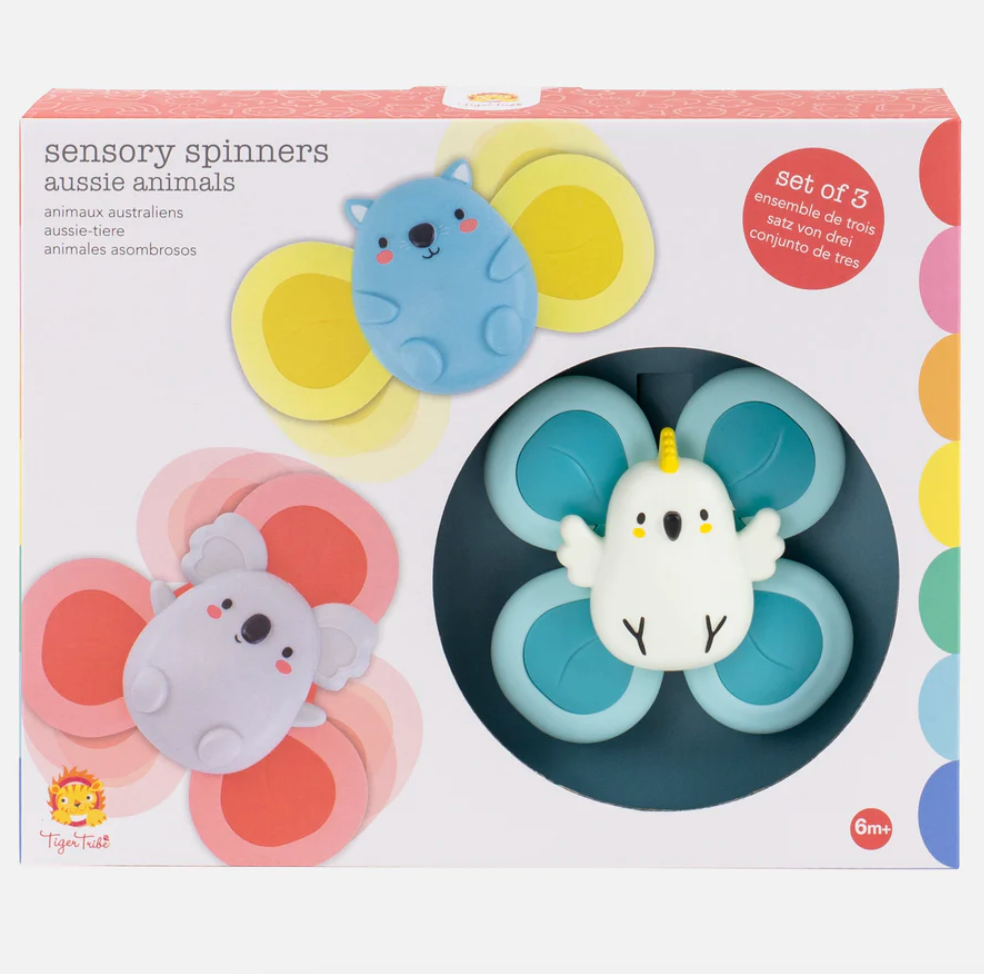 Packaging for Sensory Spinners toy set featuring Aussie Animals theme with three animal-shaped spinners visible through a window in the box. The box is colorful with a white background and includes a strong suction cup for each spinner.