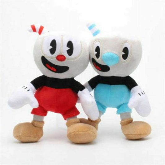 Two soft plush stuffed dolls resembling the characters Cuphead and Mughead from a video game, with one doll featuring a predominantly white color palette and the other doll featuring a predominantly blue color palette.