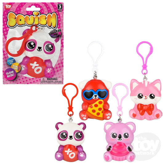 A collection of Squish toy clips in various designs, including a bear, a cat, and a pig, with the packaging indicating they are suitable for ages 3 and up.