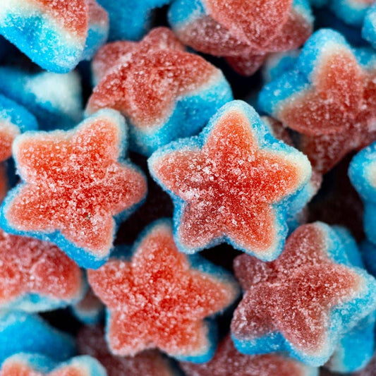 Close-up of red and blue star-shaped gummy candies.