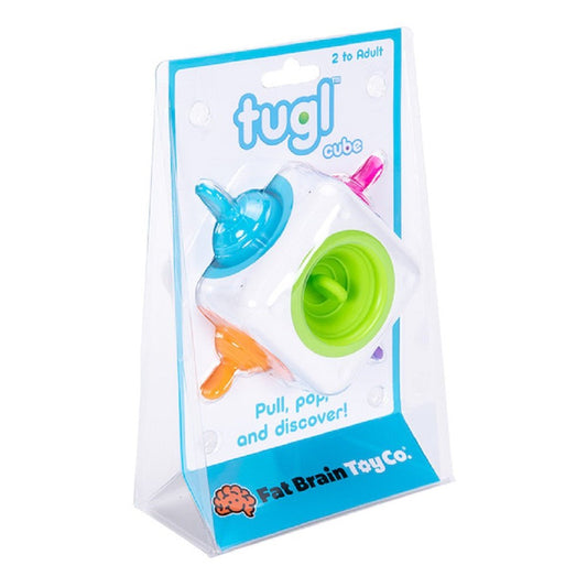 A colorful Tugl Cube with silicone bubbles, packaged in clear plastic, labeled for ages 2 and up.