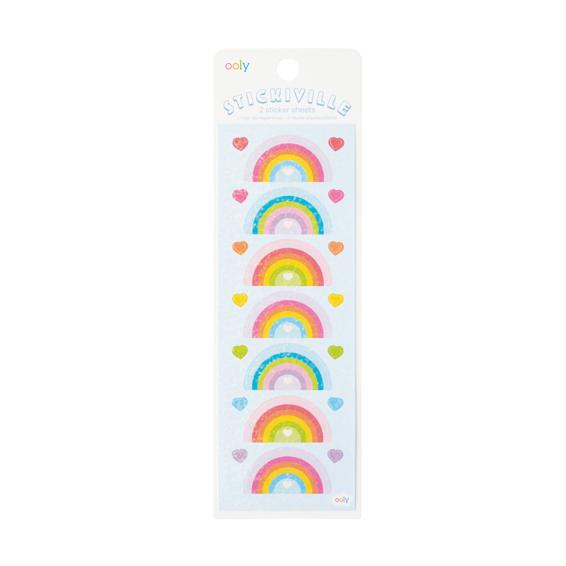 A sheet of holographic stickers with various rainbow designs and heart shapes.
