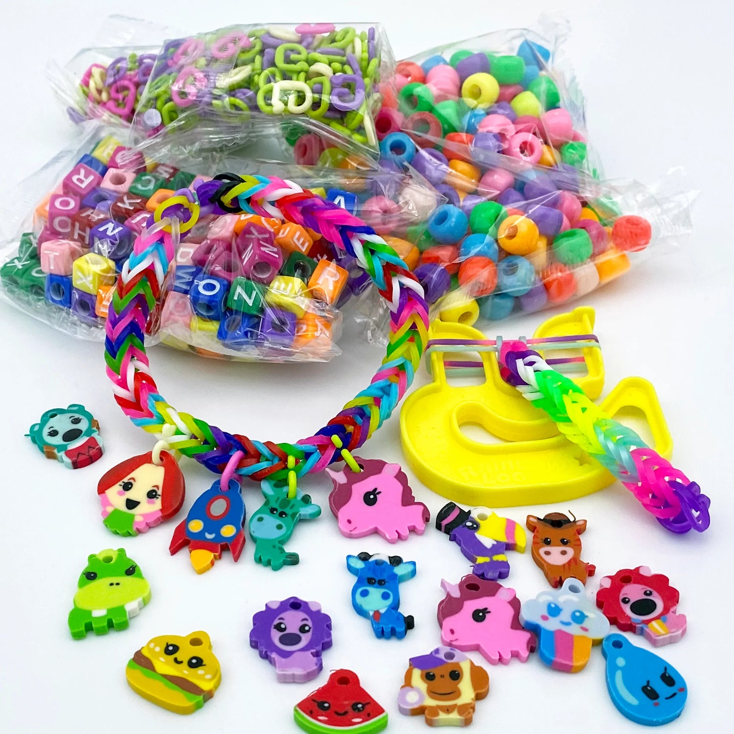 Loomi-Pals Mega Combo-Toys-Choon'S Design-This Loomi-Pals Mega Combo Set includes the following items: Rainbow Loom 2.0 Loom 2 NEW Happy Looms 2 plastic hooks 2 color instruction sheets 5600 pcs bands in 17 color assortments (colors may vary from picture) 300pcs C-clips 60 Loomipal Charms 300 assorted beads large plastic organizer case 12 gift bags-Kidz Toys