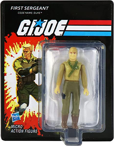 A packaged micro action figure of GI Joe in a green uniform, displayed in a blister card with a red and blue striped background.