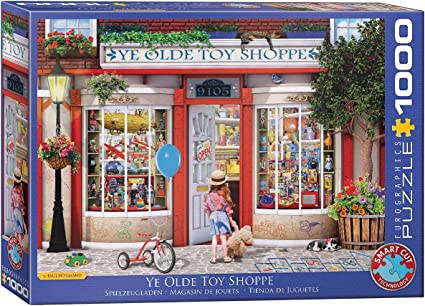 A puzzle box depicting a colorful illustration of a toy shoppe with a child and a dog in front of the store.