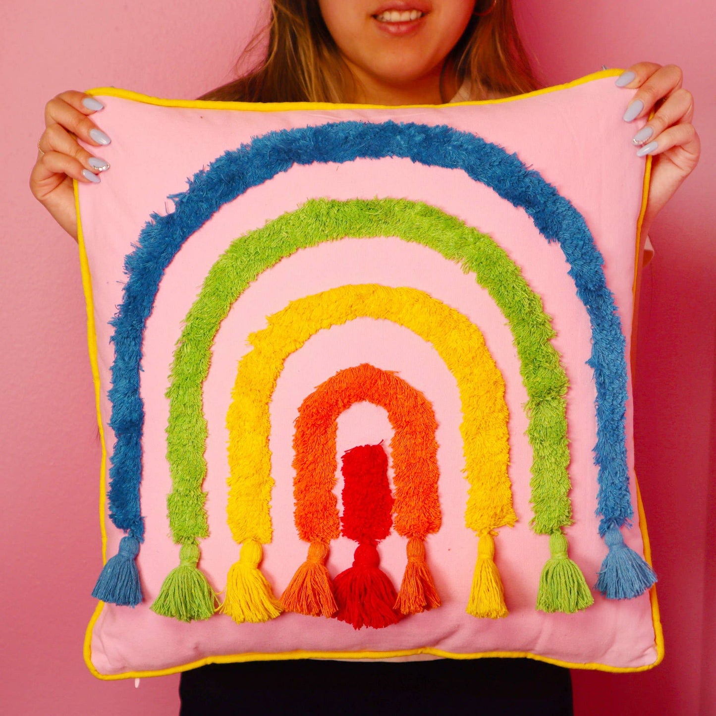 Pink boho rainbow throw pillow with tassels