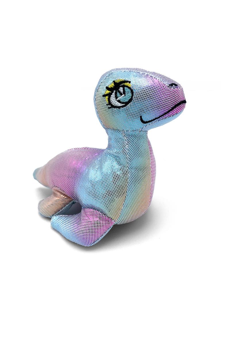 Dino Collecto! 2.5 Inch Egg-KidzToys22-Dino Collecto! 2.5” Egg Packaging in 12pc CDU – Assortment 2 Crack open GLITTERY dino eggs and reveal your fashionable new friend! Each egg contains a WILDLY ADORABLE plushie that cannot wait to play with you. Be sure to open the collector guide inside - every dino is unique! Plush is approximately 2.5-inches.-Kidz Toys